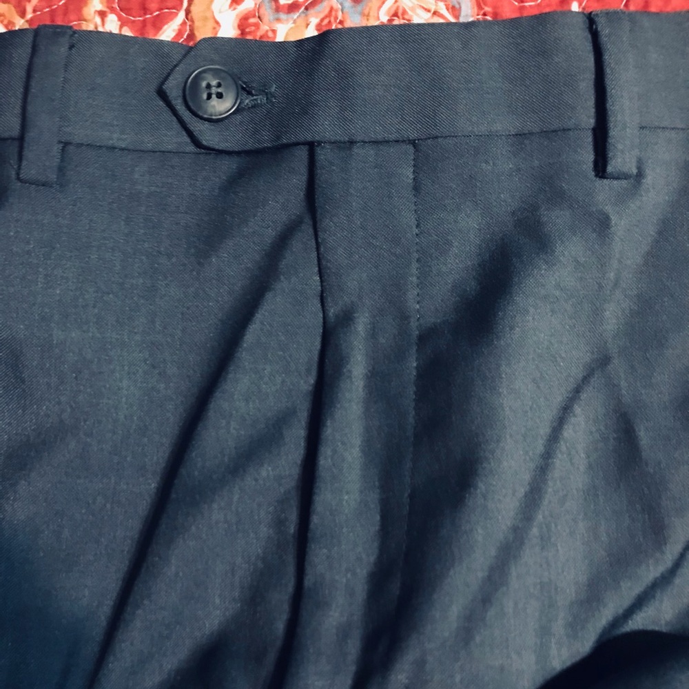 Repreve dress pants with zippered opening for prosthetic right leg.